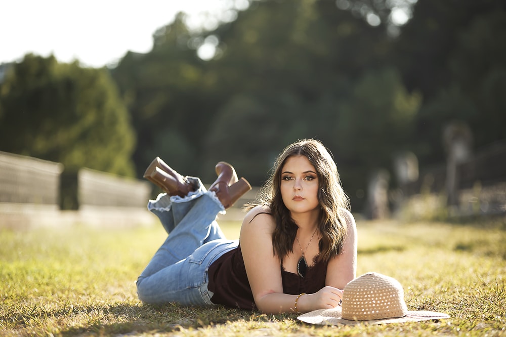 Model in a Denim Overalls Posing in the Park · Free Stock Photo