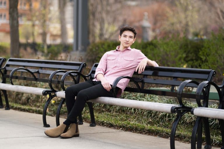 Picture of a boy sitting on a bench at Washington Park by Tonya Bolton photography.