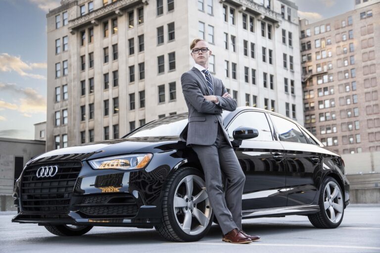 senior picture of a boy with his audi car