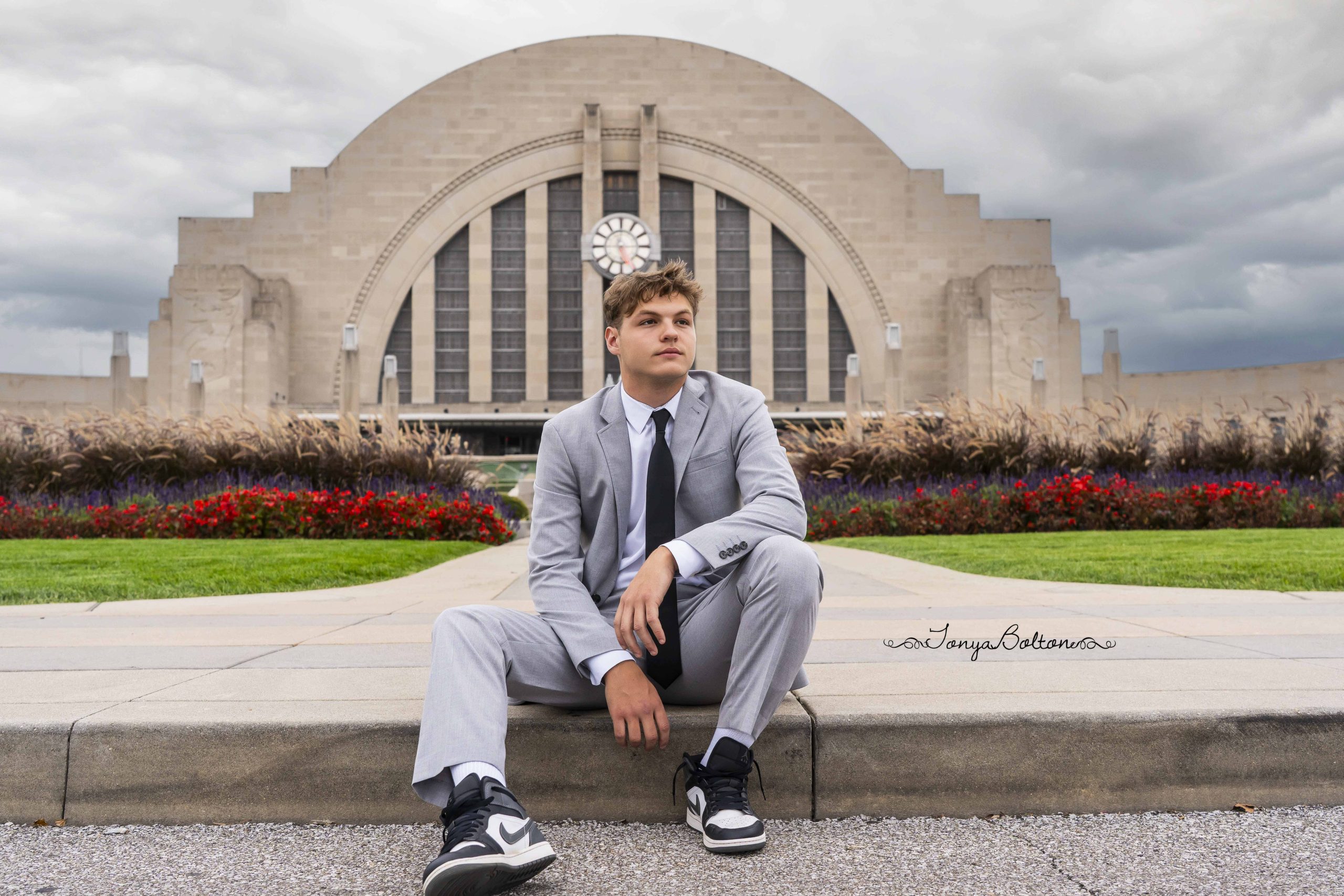 Senior portrait of a boy outside Union Terminal in Cincinnati with tonya bolton photography