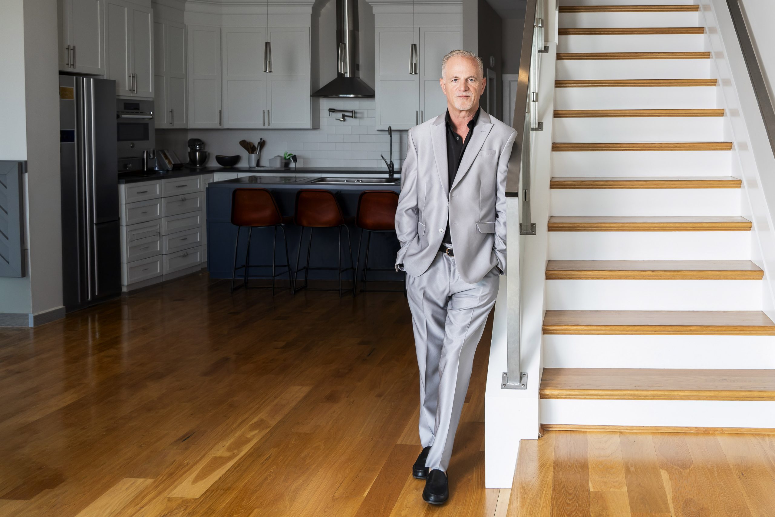 Branding portrait of Cincinnati's leading realtor, Tom Reese, standing in a high end property in Mt. Adams.